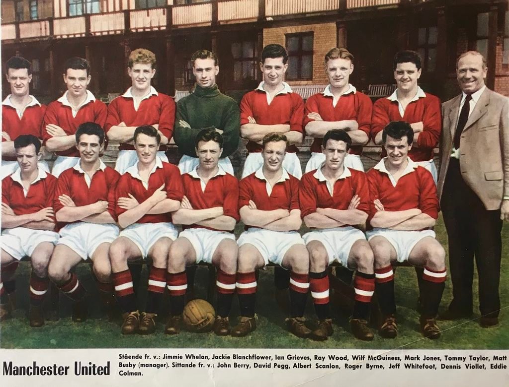 Team photo of Manchester United in 1957 in red shirts, with Matt Busby standing on the right.